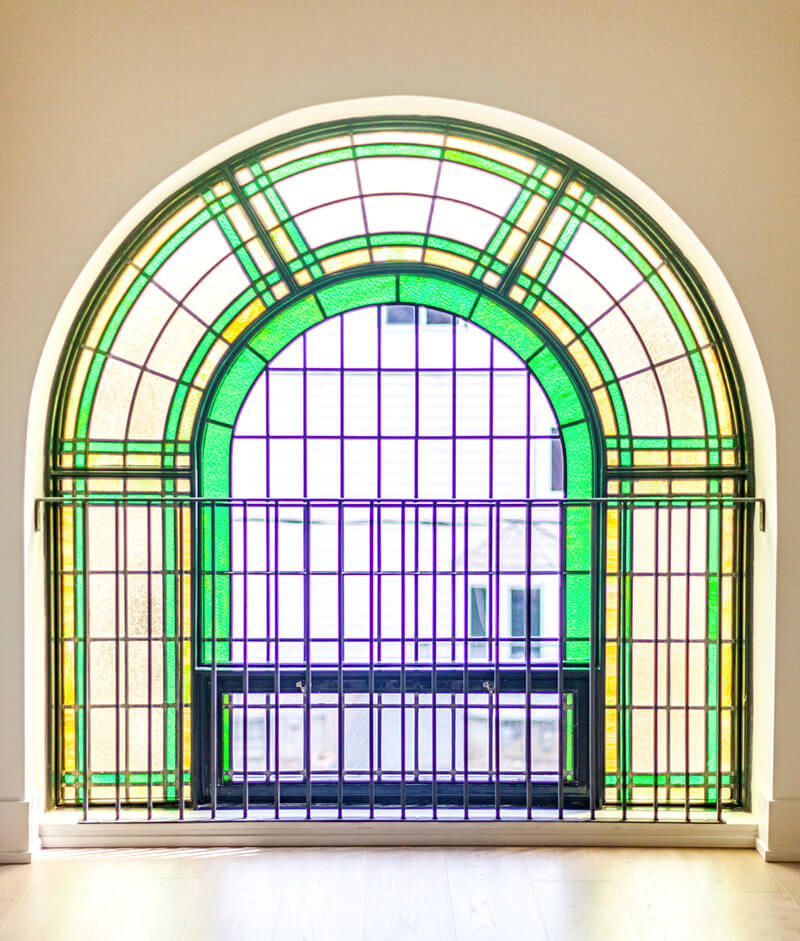 Sunday School Lofts Exterior Showing Large Stained Glass WIndow